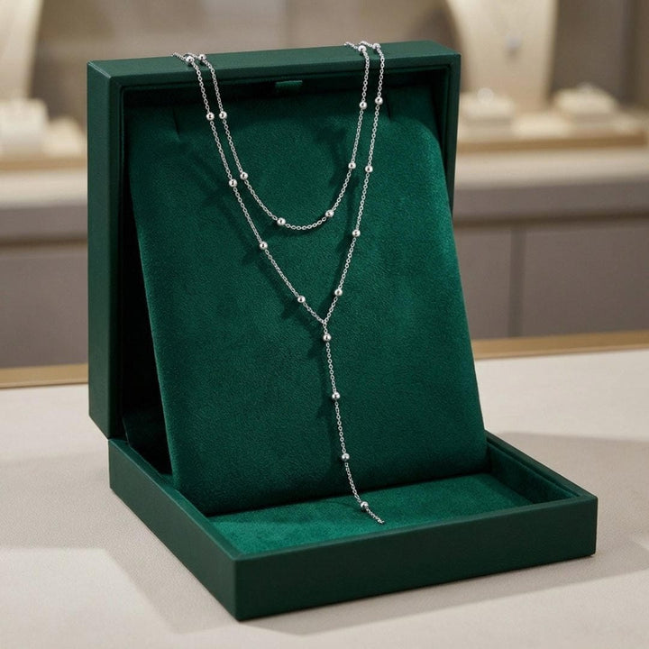 Collar de cuentas con borlas largas de doble capa dorado