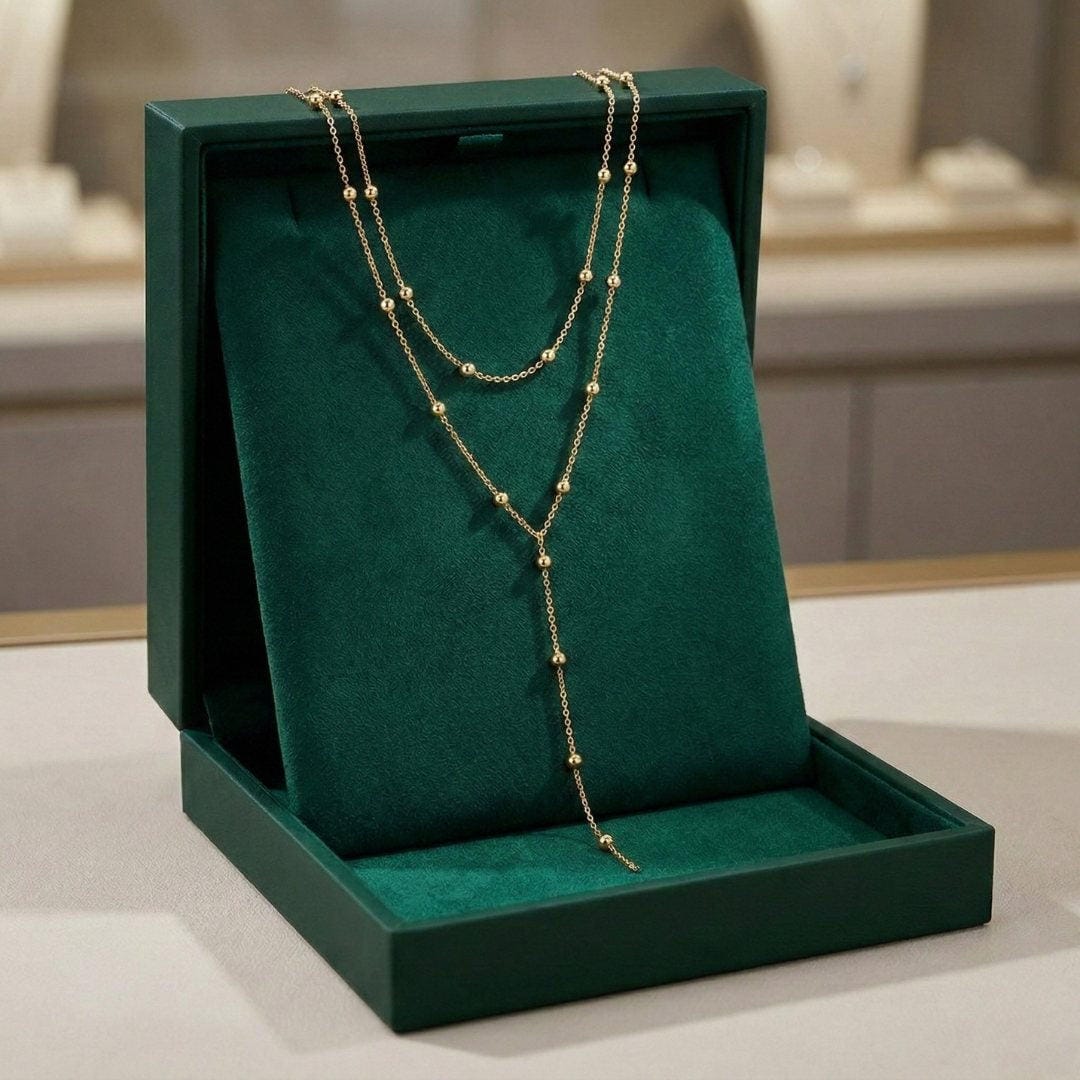 Collar de cuentas con borlas largas de doble capa dorado