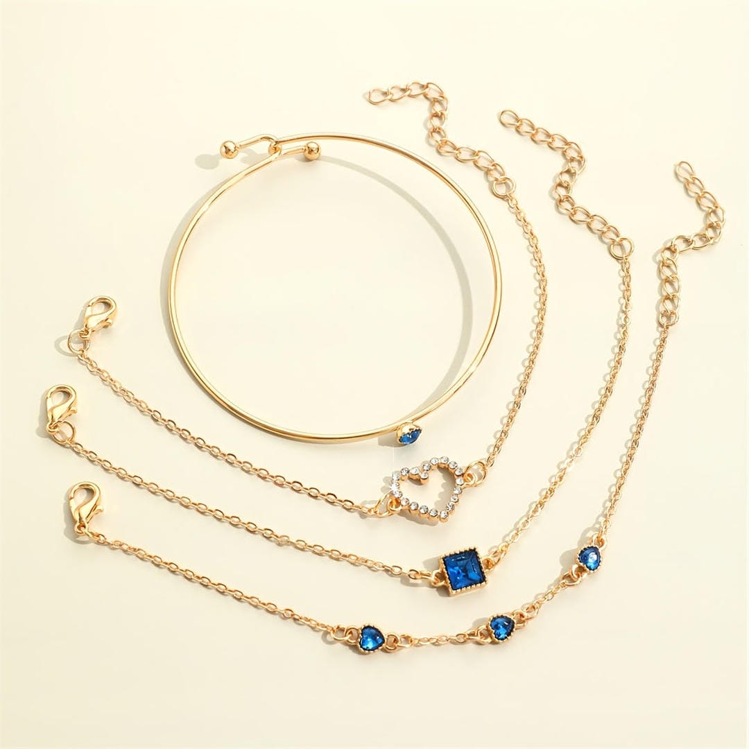 Conjunto de Pulseras de Corazones Dorados de Zafiro