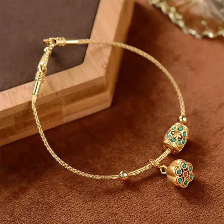 Pulsera de Loto Turquesa en Oro Antiguo