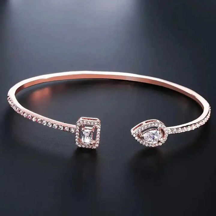 Open Gold Bracelet with Two Stones