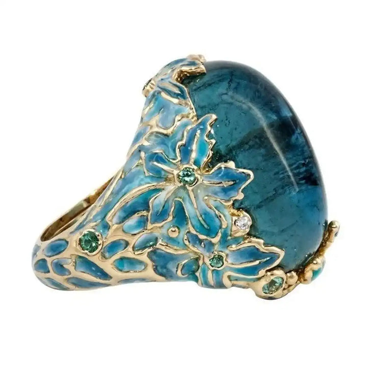 Anillo Elegante de Flor de Oro con Piedra Azul