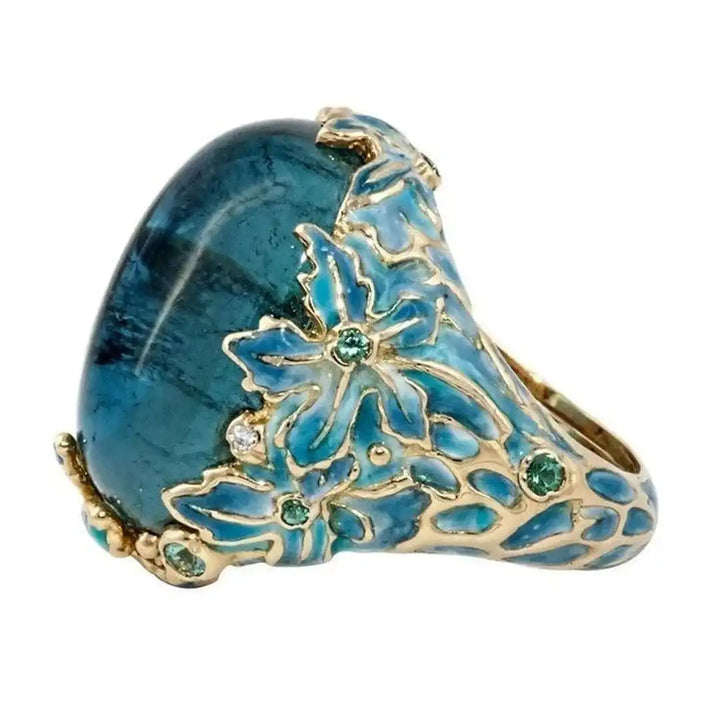 Anillo Elegante de Flor de Oro con Piedra Azul